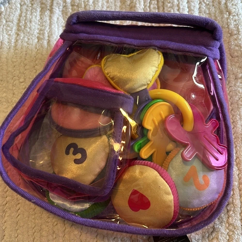 Melissa and Doug purse. Clear and pink.